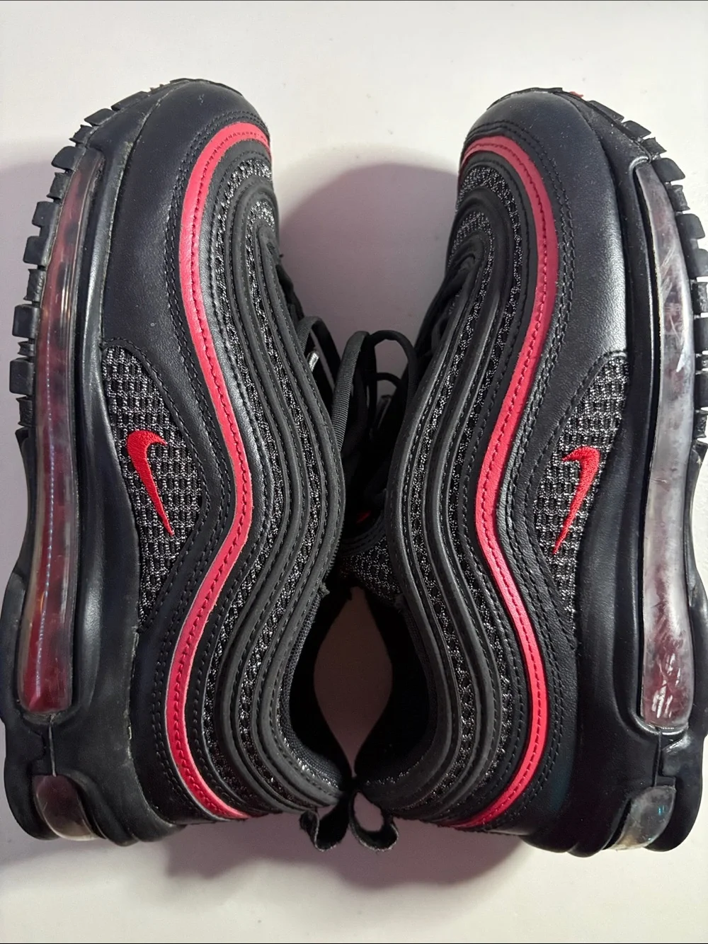 Unisex Nike AirMax (6) Black Sneakers with Red Trim.